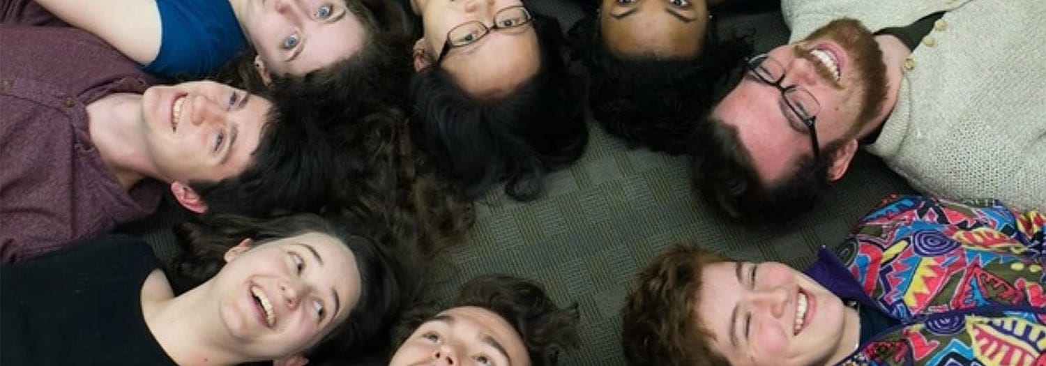 Undergraduate Studies (decorative photo of 8 students lying in a circle)