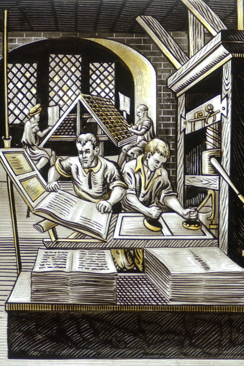 Stained glass window depicts a printer removing a page from a printing press while another inks text-blocks