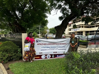 Augustina Owusu and Veneeta Dayal in front of a ALS 7 banner